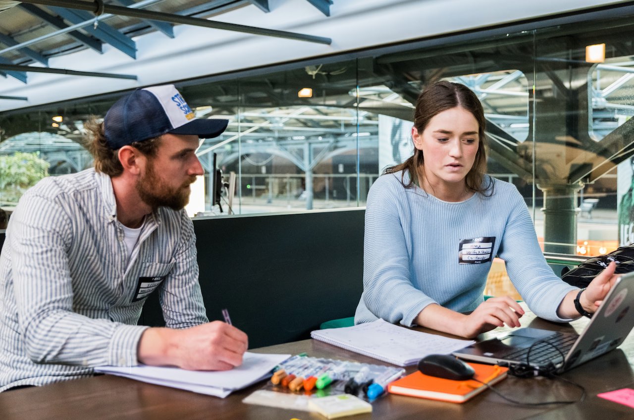 co-founders working at a meetup